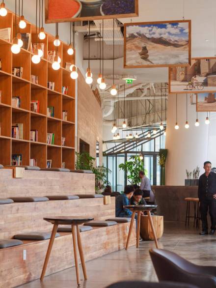 pexels-photo-244133-244133 Elegant modern workspace in Ho Chi Minh City with bookshelves and pendant lighting.